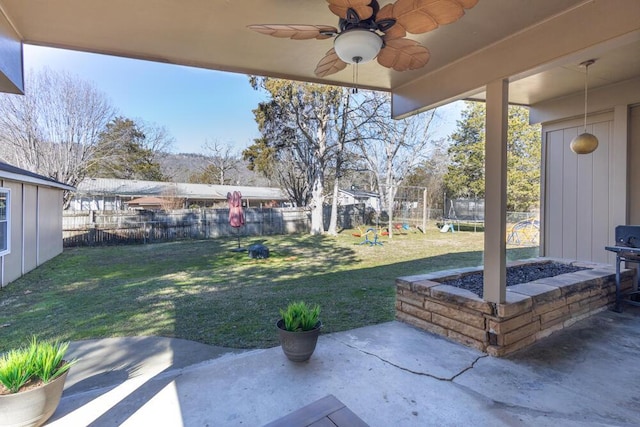 view of yard featuring a playground and a patio area