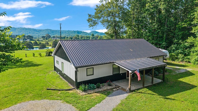 250 Creek Rd, Sweetwater, TN 37874 - view of front of home with a front lawn, a mountain view, a patio area, and metal roof