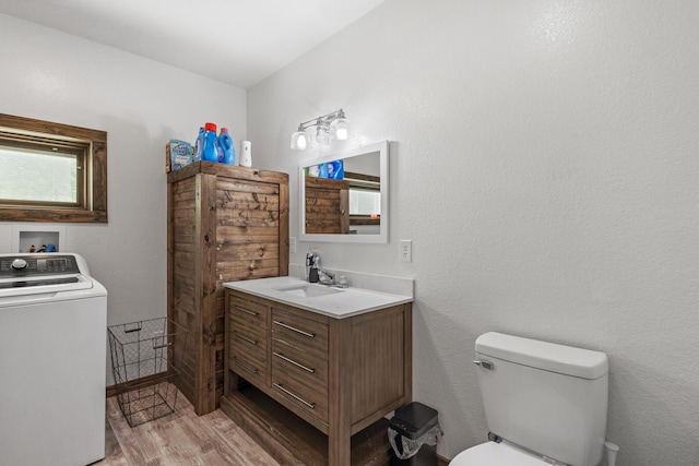 250 Creek Rd, Sweetwater, TN 37874 - bathroom with washer / clothes dryer, wood finished floors, toilet, and vanity