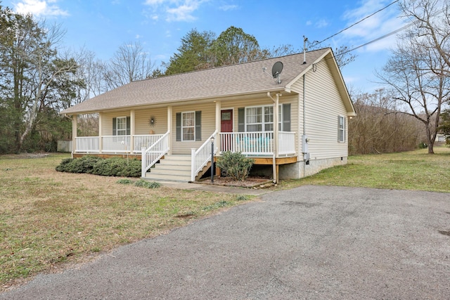 view of front of home featuring a front lawn and a porch