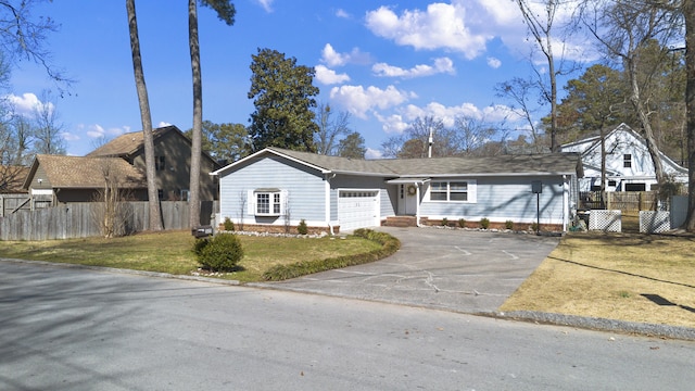 view of front of house with a garage, aphalt driveway, a front yard, and fence