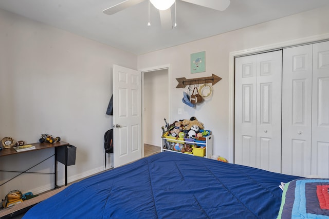 bedroom with a closet, a ceiling fan, and baseboards