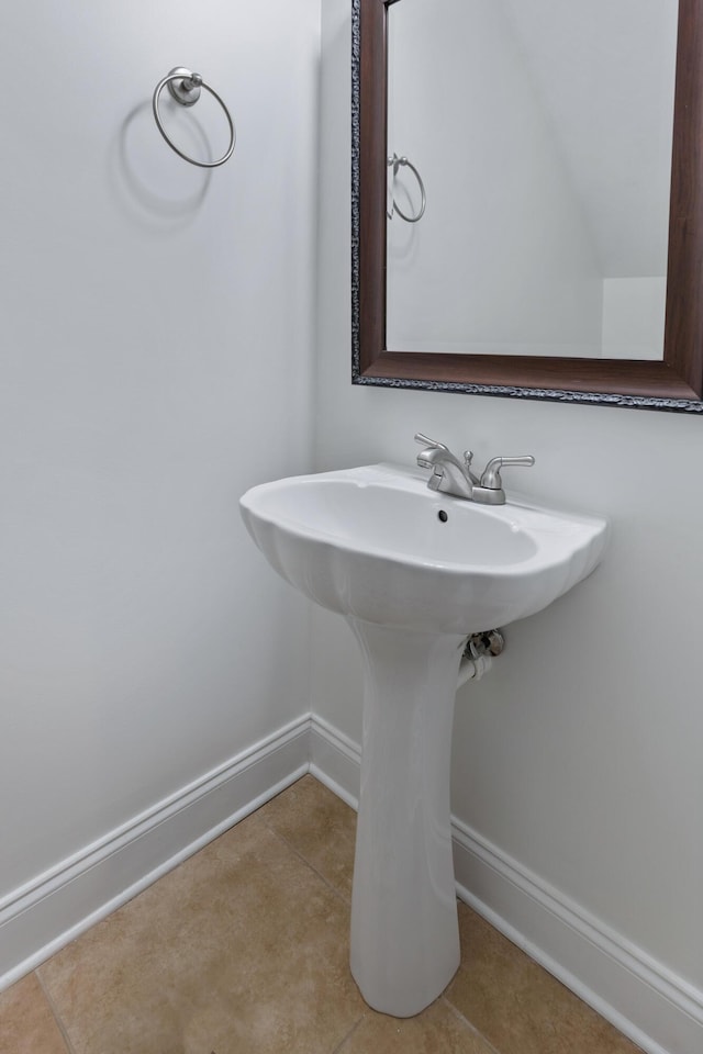 bathroom with tile patterned flooring and sink