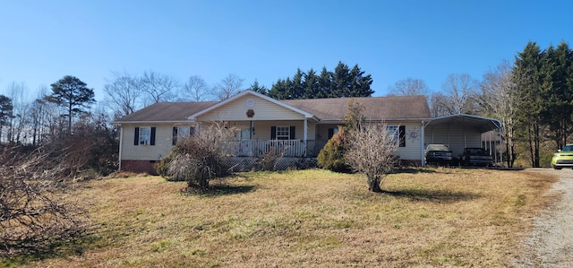 ranch-style house with a front lawn, a carport, and a porch