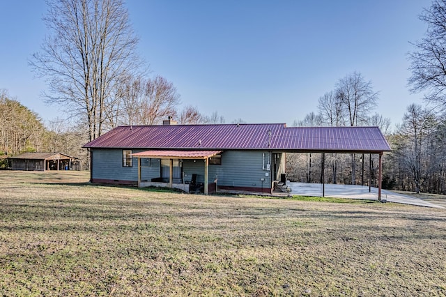 exterior space with crawl space, metal roof, a chimney, and a front lawn