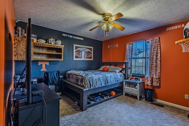 bedroom with carpet, baseboards, visible vents, ceiling fan, and a textured ceiling