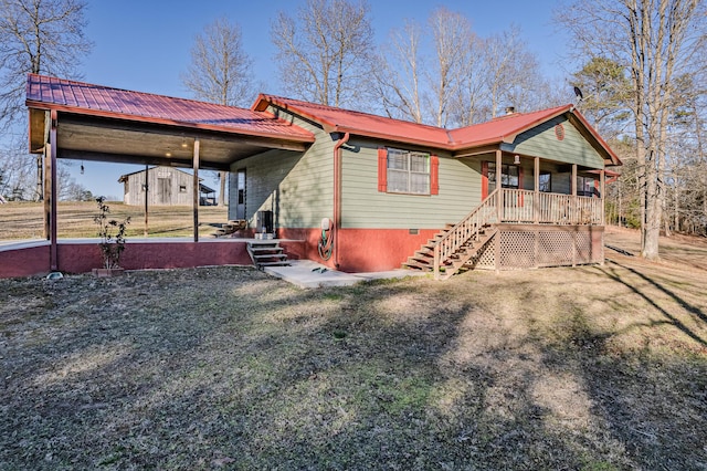 view of front facade featuring crawl space, covered porch, and metal roof