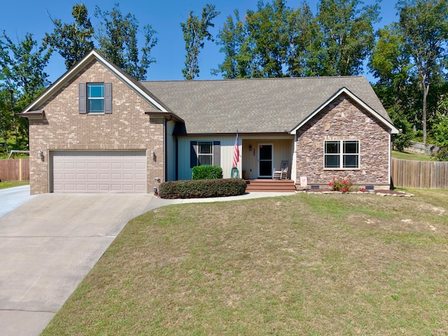 view of front of house with a garage and a front lawn