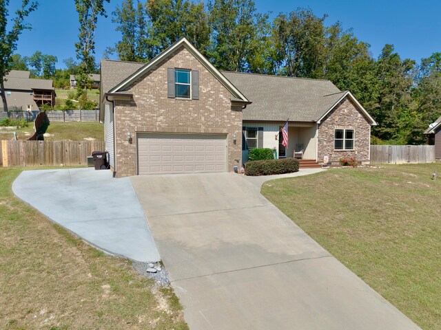 view of front of property with a garage and a front lawn