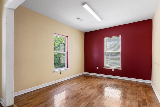 spare room featuring hardwood / wood-style flooring