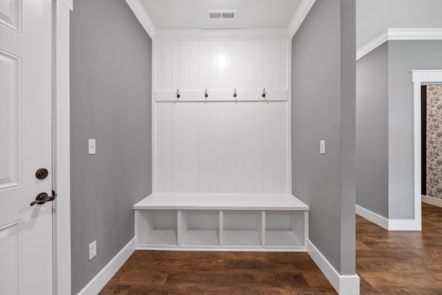 mudroom featuring crown molding and dark wood-type flooring