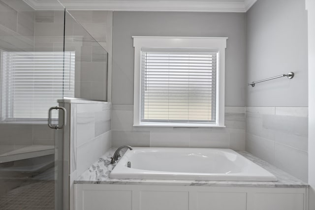 bathroom with shower with separate bathtub and crown molding