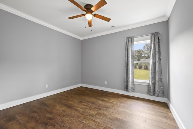 spare room with ceiling fan, dark wood-type flooring, and ornamental molding