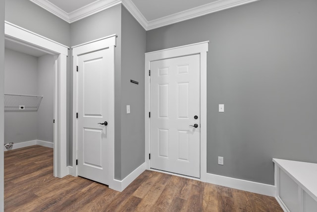 foyer entrance featuring dark hardwood / wood-style flooring and crown molding