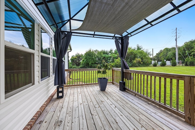 wooden terrace with a yard