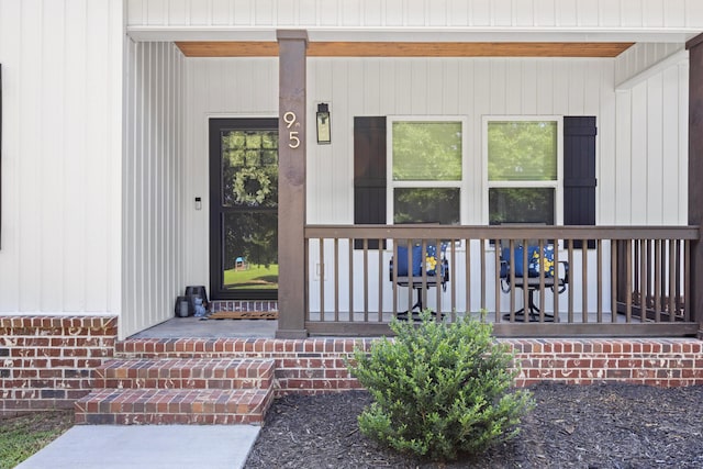 doorway to property featuring a porch