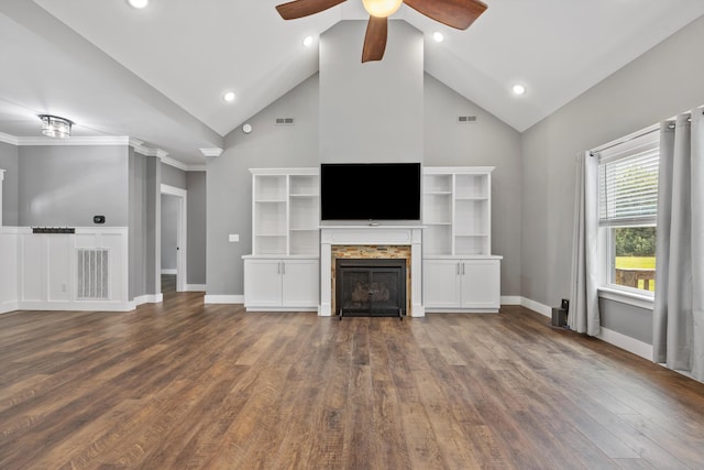 unfurnished living room with ceiling fan, crown molding, dark wood-type flooring, and high vaulted ceiling