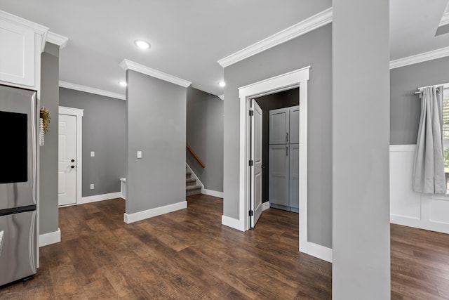 interior space with crown molding and dark wood-type flooring