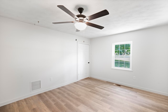 empty room with light hardwood / wood-style floors and ceiling fan