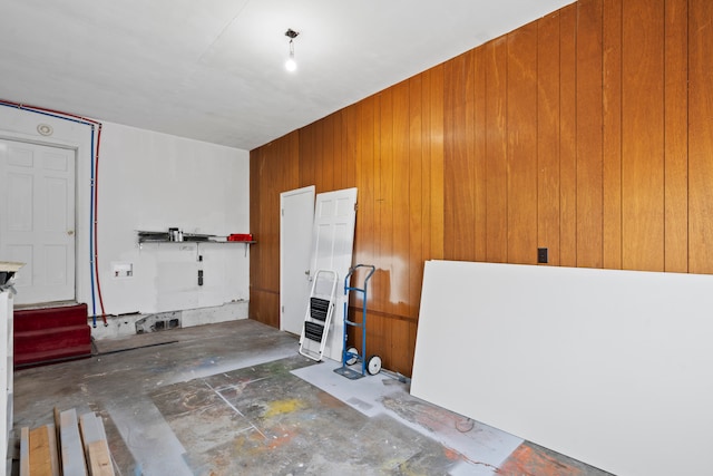 interior space featuring wooden walls and heating unit