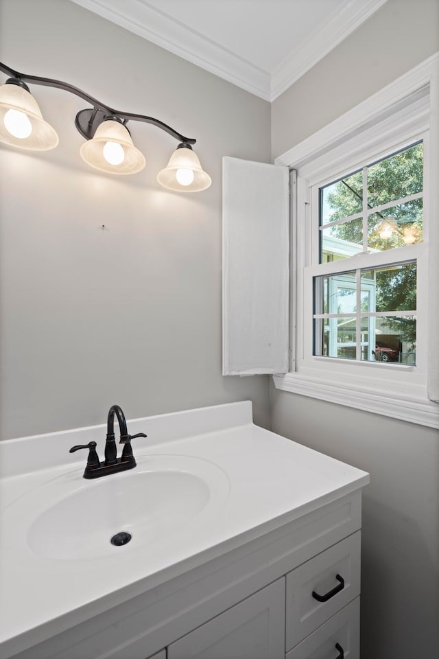 bathroom featuring vanity and crown molding