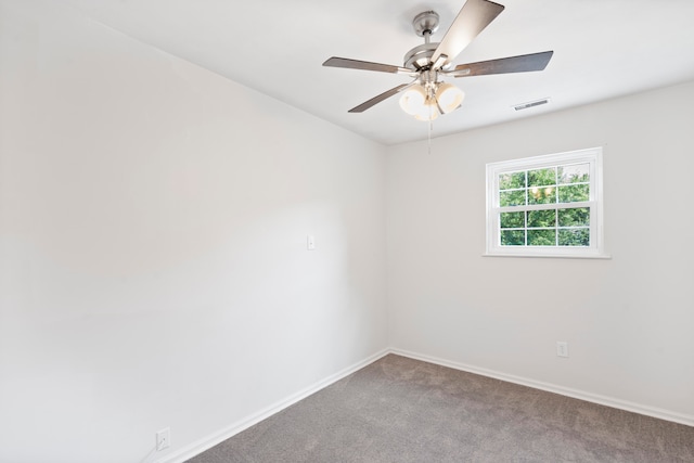 empty room with carpet flooring and ceiling fan