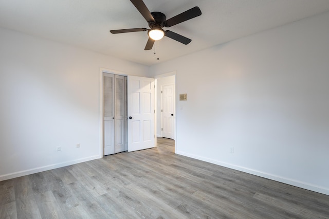 unfurnished room with ceiling fan and light hardwood / wood-style flooring