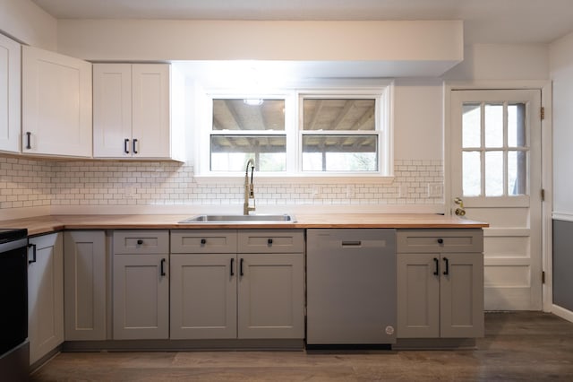 kitchen with gray cabinets, sink, dishwasher, and wood counters