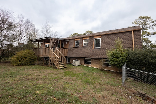 back of property with a yard and cooling unit