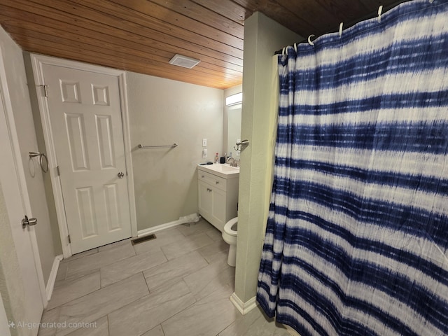 1568 Perry St SE, Cleveland, TN 37311 - bathroom featuring wood ceiling, vanity, a shower with curtain, toilet, and baseboards
