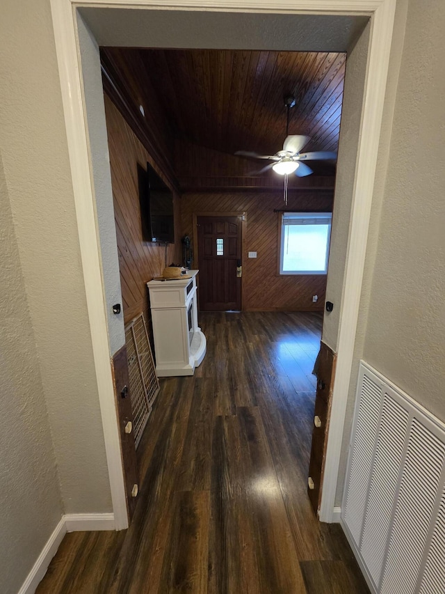 1568 Perry St SE, Cleveland, TN 37311 - corridor featuring wooden walls, dark wood-style flooring, a textured wall, wood ceiling, and baseboards