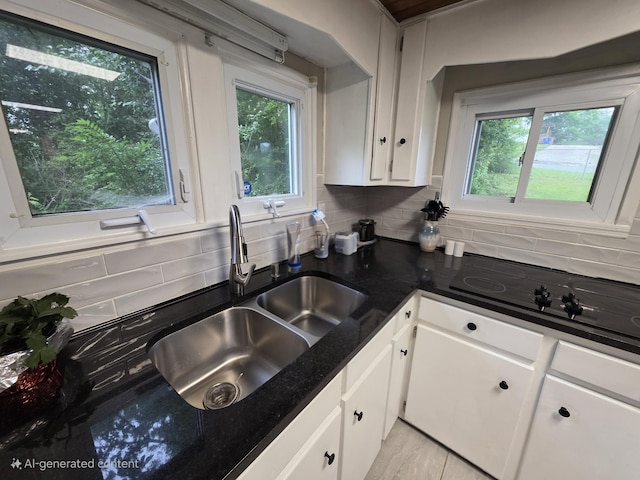 1568 Perry St SE, Cleveland, TN 37311 - kitchen with a sink, white cabinetry, decorative backsplash, and plenty of natural light