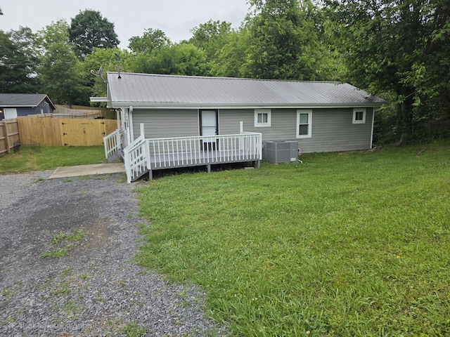 1568 Perry St SE, Cleveland, TN 37311 - back of house featuring a wooden deck, metal roof, and central air condition unit
