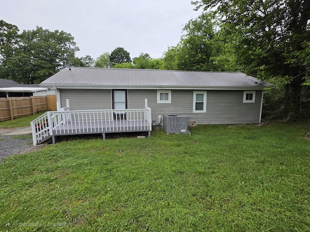 1568 Perry St SE, Cleveland, TN 37311 - back of property with central air condition unit, a wooden deck, and metal roof