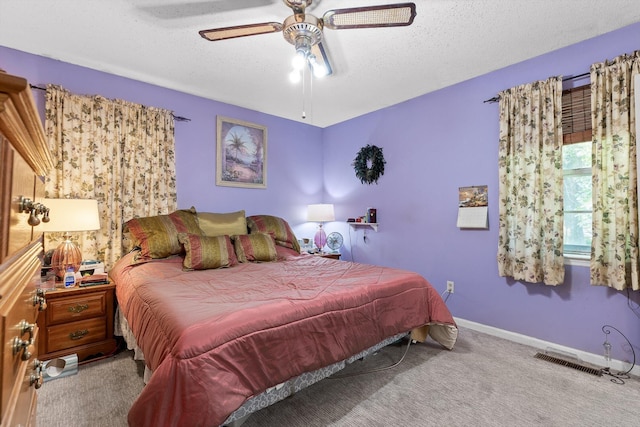 250 Rocky Ford Rd, Rossville, GA 30741 - bedroom with carpet floors, a textured ceiling, baseboards, and a ceiling fan