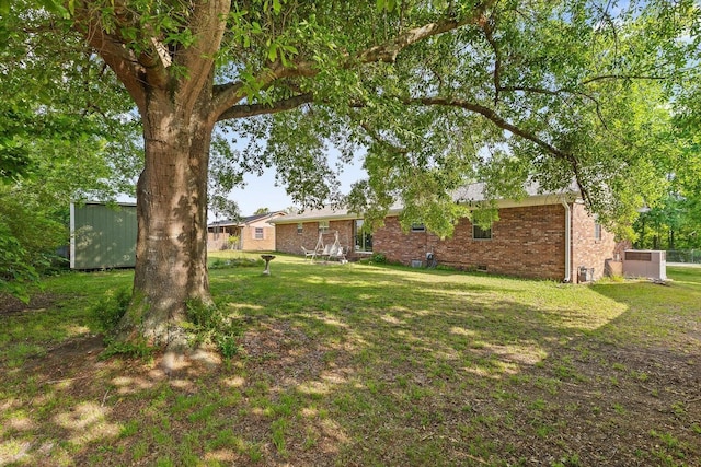 250 Rocky Ford Rd, Rossville, GA 30741 - view of grassy yard with an outdoor structure and a shed
