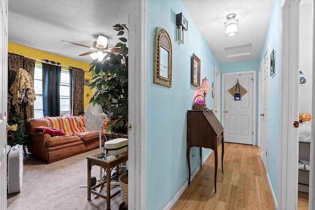 250 Rocky Ford Rd, Rossville, GA 30741 - hall with a textured ceiling, light wood-style flooring, and baseboards