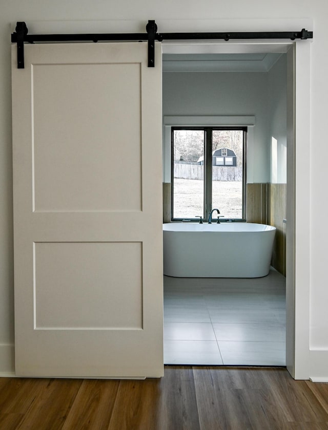 interior space featuring a bathtub and wood-type flooring