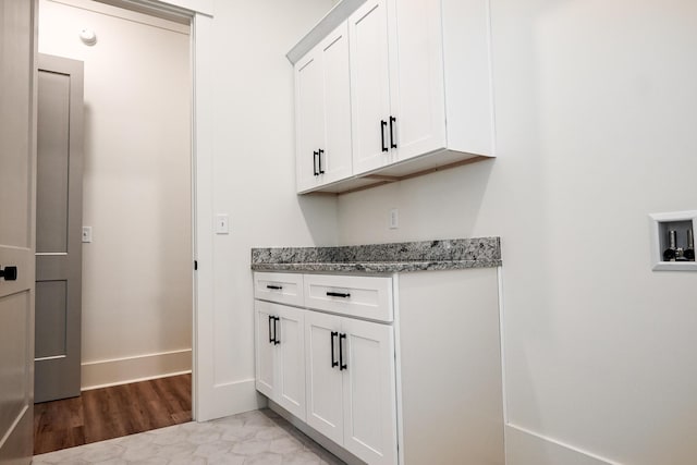 interior space featuring cabinets and light hardwood / wood-style floors