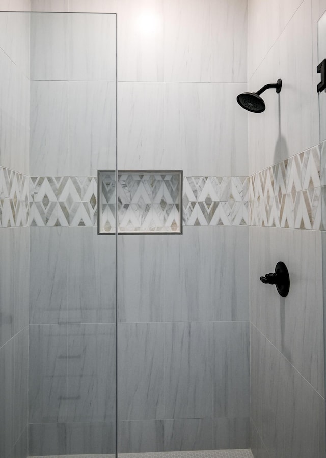 bathroom with tiled shower