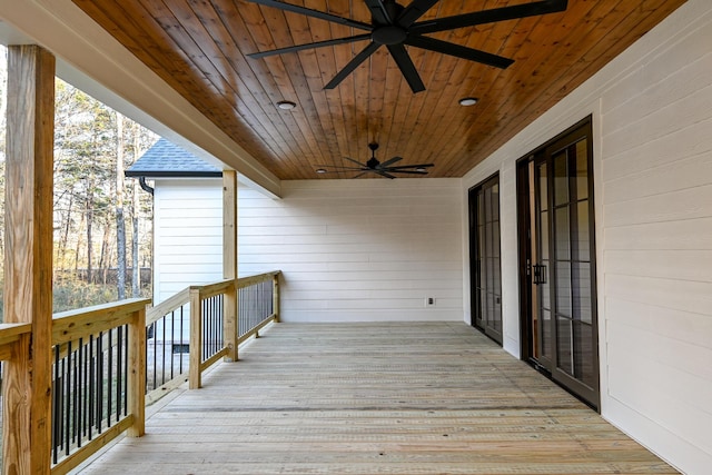 wooden deck featuring ceiling fan