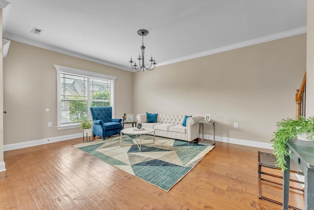 living room with ornamental molding and hardwood / wood-style flooring