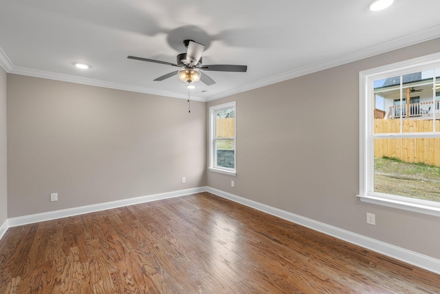 unfurnished room featuring hardwood / wood-style flooring, ceiling fan, and crown molding