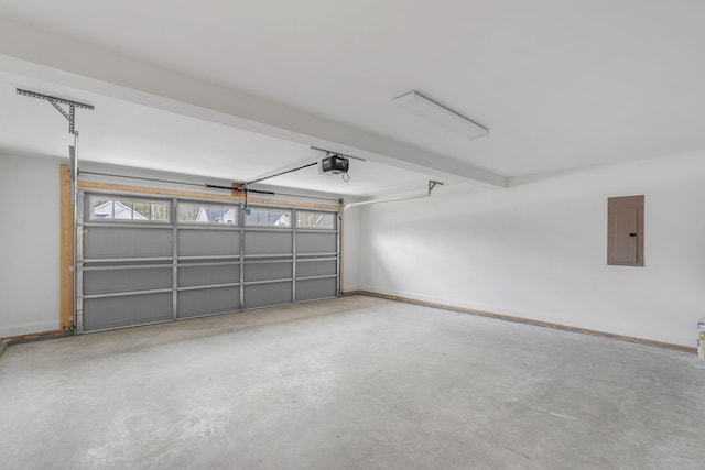 garage featuring electric panel and a garage door opener