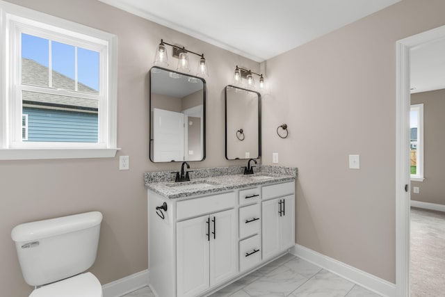 bathroom featuring vanity and toilet