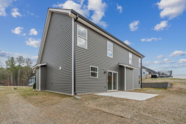 rear view of property featuring a patio area