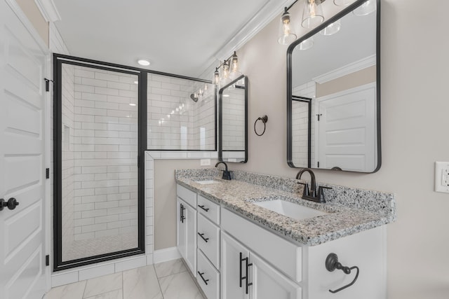 bathroom with vanity, an enclosed shower, and crown molding