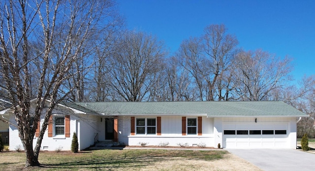 ranch-style house featuring brick siding, roof with shingles, a garage, driveway, and a front lawn