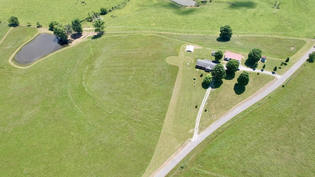 bird's eye view with a water view and a rural view