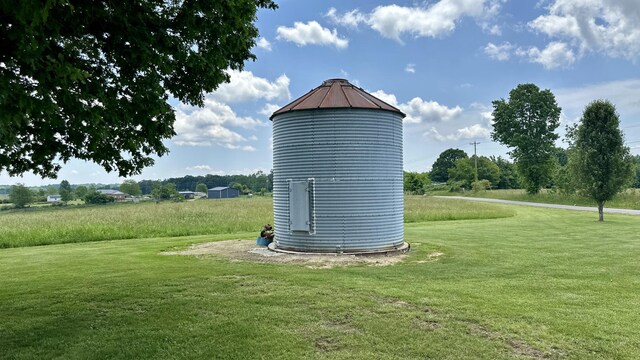 view of outdoor structure with a lawn